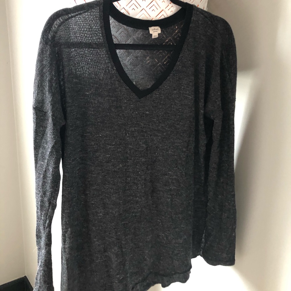 Lightweight long sleeve sweater with V neck.